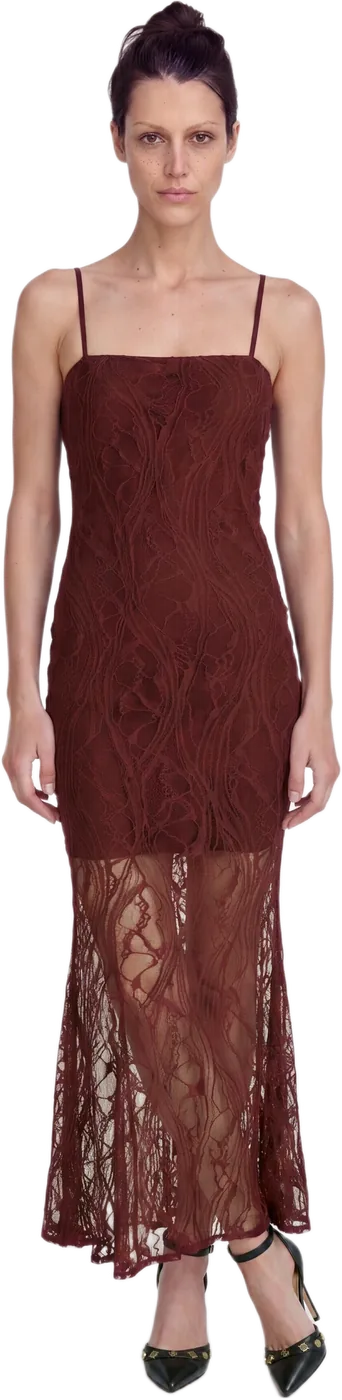 A model in a burgundy lace maxi dress, full length