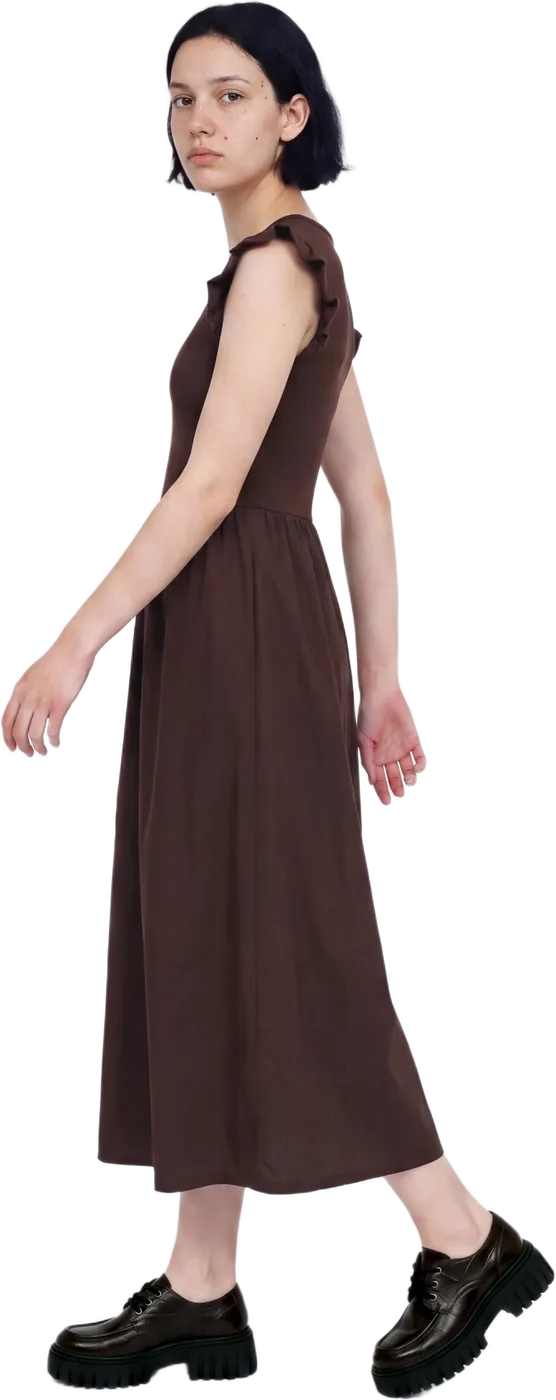 A model in a brown midi dress, walking, full length
